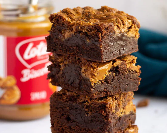 A stack of three peanut butter brownies on top of each other.